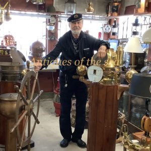 Man In Captain Hat with Nautical Items